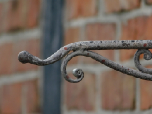 Ornate curved hanging basket wall hook - aged metal