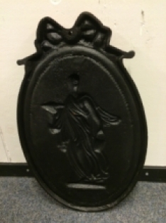 Wall ornament, heavy cast iron, oriental woman in colour.