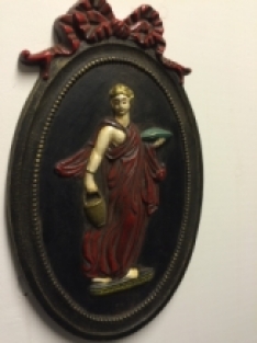 Wall ornament, heavy cast iron, oriental woman in colour.