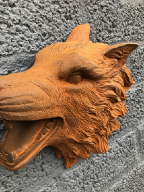 Wolf head, cast iron wall ornament with a rustic surface