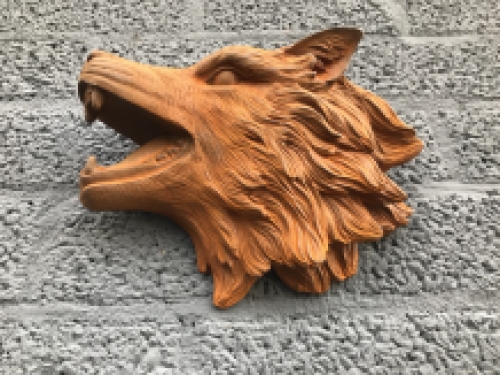 Wolf head, cast iron wall ornament with a rustic surface