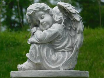 Sitting angel on pedestal - full stone